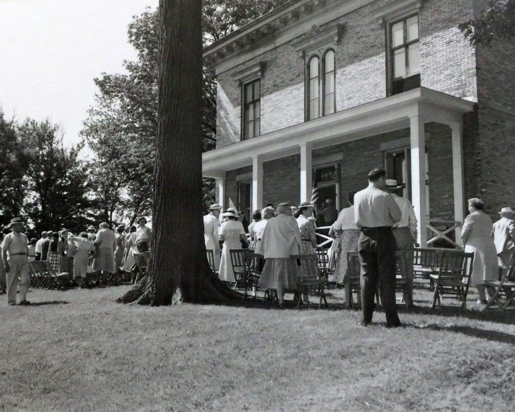 1954 museum opening at Taylor House Group of people in front of brick home