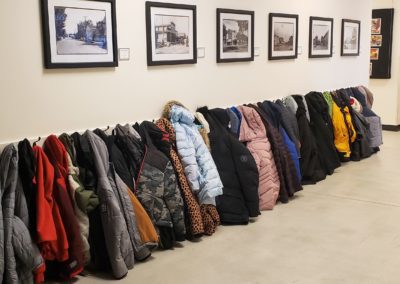 A line of little coats hang on the wall during a Full Day Education Program and the Sheboygan County Museum