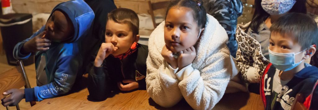 Students visit the Weinhold Log Cabin during the Museum's Full Day Education program Four elem