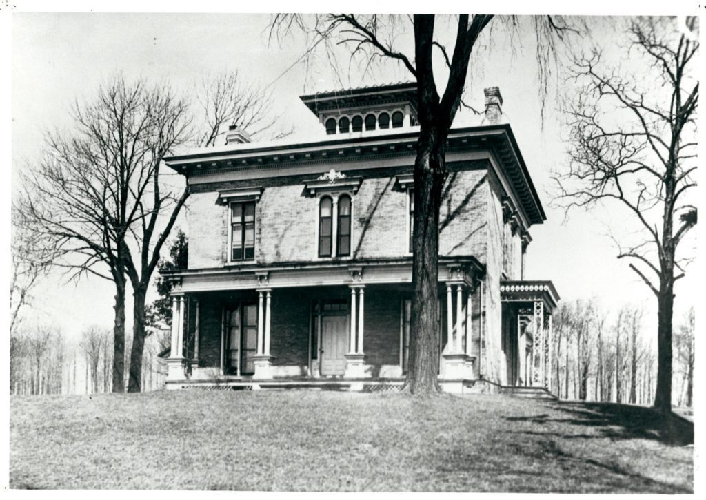 Black and white photograph of the Taylor House with dark-painted trim. The Taylor House was the first permanent home of the Sheboygan County Historical Society.