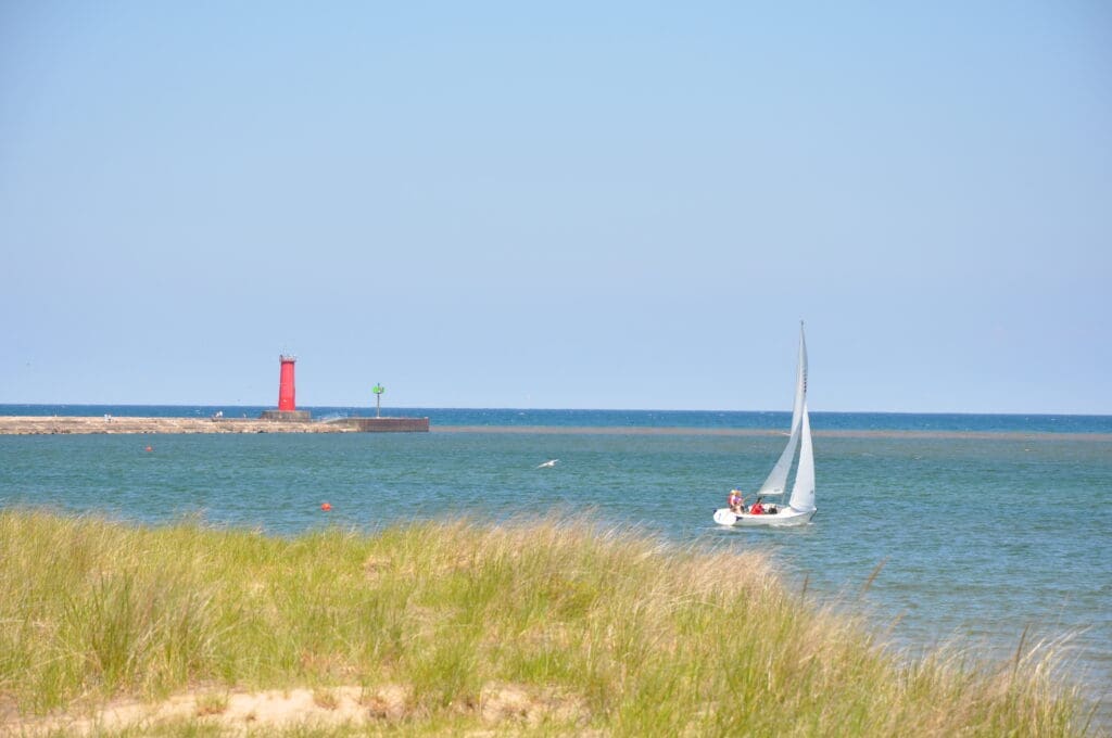 Lake Michigan at Sheboygan with sailboat and lighthouse in background